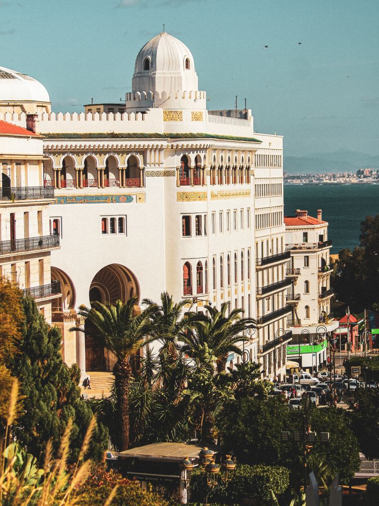 Stunning view of historic architecture in Algiers with Mediterranean backdrop.